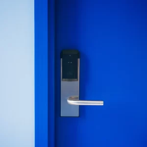 Startsidan 11 a blue door with a electronic lock
